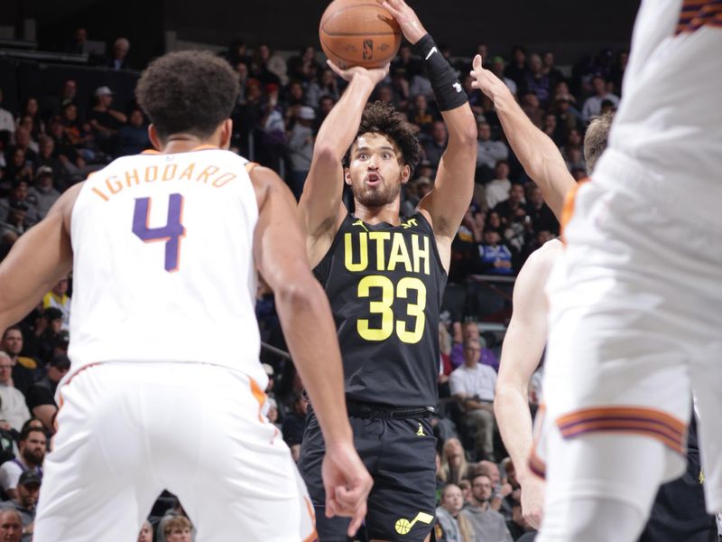 SALT LAKE CITY, UT - NOVEMBER 12: Johnny Juzang #33 of the Utah Jazz shoots the ball during the game against the Phoenix Suns during the Emirates NBA Cup game on November 12, 2024 at vivint.SmartHome Arena in Salt Lake City, Utah. NOTE TO USER: User expressly acknowledges and agrees that, by downloading and or using this Photograph, User is consenting to the terms and conditions of the Getty Images License Agreement. Mandatory Copyright Notice: Copyright 2024NBAE (Photo by Melissa Majchrzak/NBAE via Getty Images)