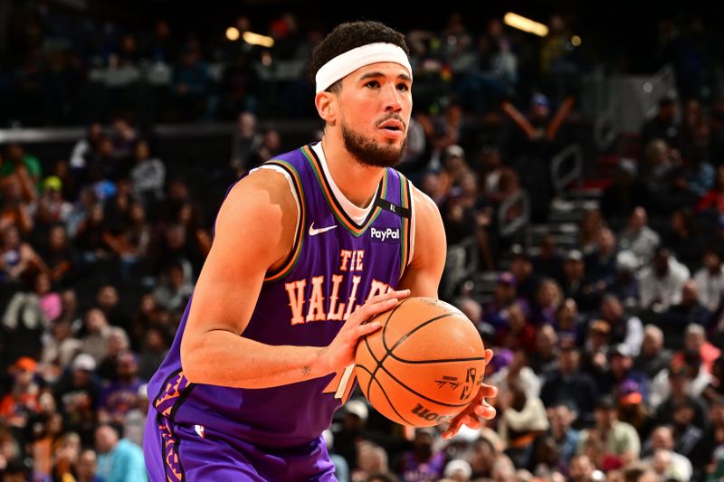 PHOENIX, AZ - NOVEMBER 18: Devin Booker #1 of the Phoenix Suns prepares to shoot a free throw during the game against the Orlando Magic on November 18, 2024 at Footprint Center in Phoenix, Arizona. NOTE TO USER: User expressly acknowledges and agrees that, by downloading and or using this photograph, user is consenting to the terms and conditions of the Getty Images License Agreement. Mandatory Copyright Notice: Copyright 2024 NBAE (Photo by Kate Frese/NBAE via Getty Images)