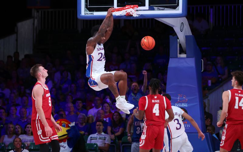 Nov 24, 2022; Paradise Island, BAHAMAS; Kansas Jayhawks forward K.J. Adams Jr. (24) dunks during the second half against the Wisconsin Badgers at Imperial Arena. Mandatory Credit: Kevin Jairaj-USA TODAY Sports