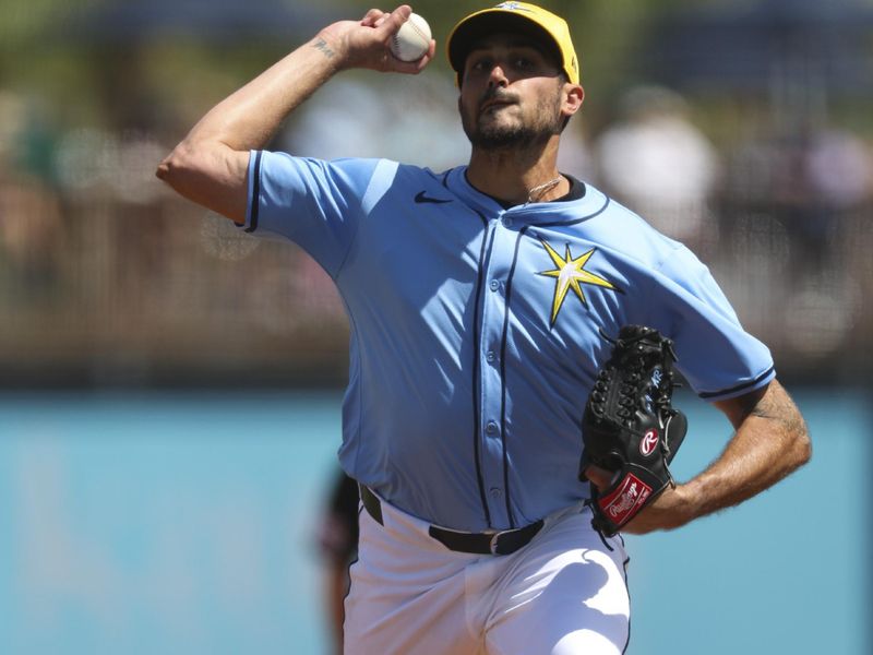 Mar 11, 2024; Port Charlotte, Florida, USA;  Tampa Bay Rays starting pitcher Zach Eflin (24) throws a pitch against the Toronto Blue Jays in the third inning at Charlotte Sports Park. Mandatory Credit: Nathan Ray Seebeck-USA TODAY Sports