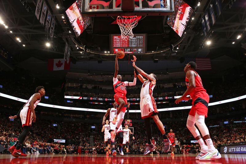 TORONTO, CANADA - JANUARY 17: Chris Boucher #25 of the Toronto Raptors drives to the basket during the game against the Miami Heat on January 17, 2024 at the Scotiabank Arena in Toronto, Ontario, Canada.  NOTE TO USER: User expressly acknowledges and agrees that, by downloading and or using this Photograph, user is consenting to the terms and conditions of the Getty Images License Agreement.  Mandatory Copyright Notice: Copyright 2024 NBAE (Photo by Vaughn Ridley/NBAE via Getty Images)