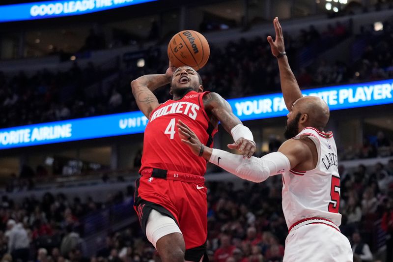 CHICAGO, ILLINOIS - NOVEMBER 17: Jalen Green #4 of the Houston Rockets goes up for a shot against Jevon Carter #5 of the Chicago Bulls during the third quarter at the United Center on November 17, 2024 in Chicago, Illinois. NOTE TO USER: User expressly acknowledges and agrees that, by downloading and or using this photograph, User is consenting to the terms and conditions of the Getty Images License Agreement. (Photo by Patrick McDermott/Getty Images)