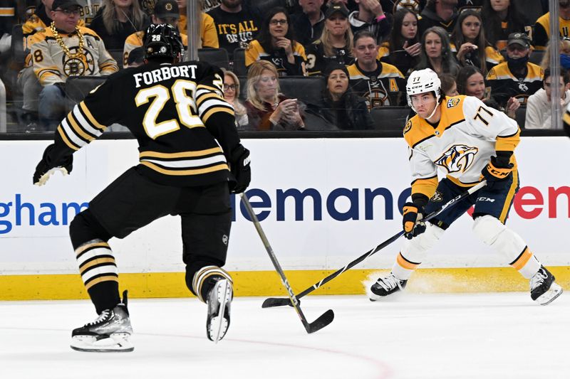 Oct 14, 2023; Boston, Massachusetts, USA; Nashville Predators right wing Luke Evangelista (77) skates against Boston Bruins defenseman Derek Forbort (28) during the first period at the TD Garden. Mandatory Credit: Brian Fluharty-USA TODAY Sports