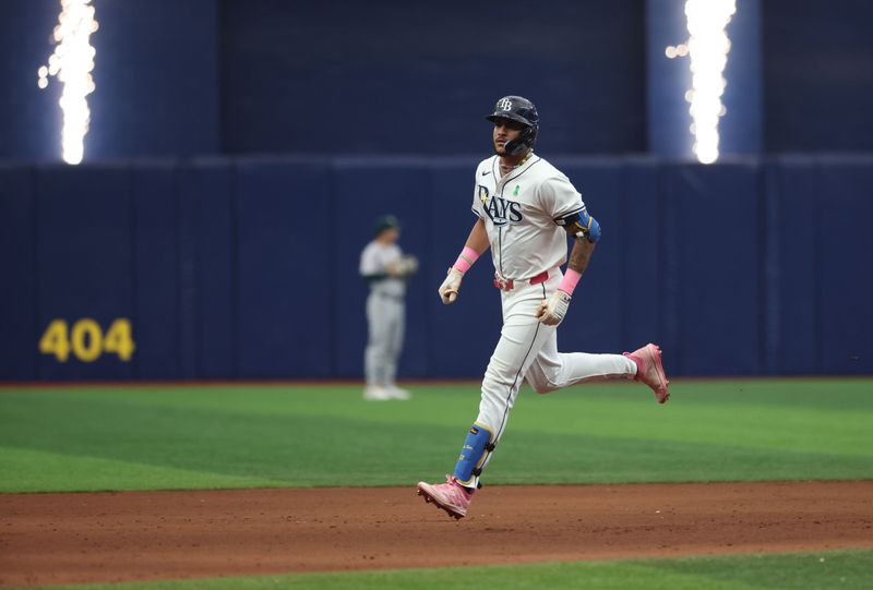 May 30, 2024; St. Petersburg, Florida, USA;  Tampa Bay Rays outfielder Jose Siri (22) runs round the bases after he hits a home run against the Oakland Athletics during the ninth inning at Tropicana Field. Mandatory Credit: Kim Klement Neitzel-USA TODAY Sports