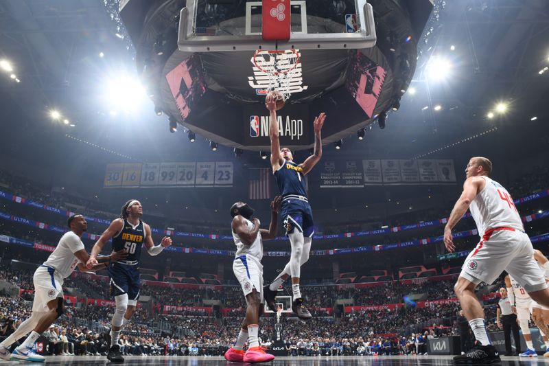 LOS ANGELES, CA - APRIL 4: Michael Porter Jr. #1 of the Denver Nuggets drives to the basket during the game against the LA Clippers on April 4, 2024 at Crypto.Com Arena in Los Angeles, California. NOTE TO USER: User expressly acknowledges and agrees that, by downloading and/or using this Photograph, user is consenting to the terms and conditions of the Getty Images License Agreement. Mandatory Copyright Notice: Copyright 2024 NBAE (Photo by Adam Pantozzi/NBAE via Getty Images)