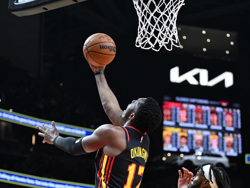 ATLANTA, GA - JANUARY 12: Onyeka Okongwu #17 of the Atlanta Hawks shoots the ball during the game against the Indiana Pacers on January 12, 2024 at State Farm Arena in Atlanta, Georgia.  NOTE TO USER: User expressly acknowledges and agrees that, by downloading and/or using this Photograph, user is consenting to the terms and conditions of the Getty Images License Agreement. Mandatory Copyright Notice: Copyright 2024 NBAE (Photo by Adam Hagy/NBAE via Getty Images)