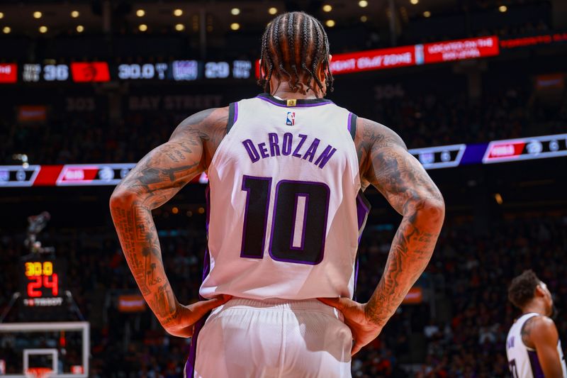 TORONTO, CANADA - NOVEMBER 2: DeMar DeRozan #10 of the Sacramento Kings looks on during the game against the Toronto Raptors on November 2, 2024 at the Scotiabank Arena in Toronto, Ontario, Canada.  NOTE TO USER: User expressly acknowledges and agrees that, by downloading and or using this Photograph, user is consenting to the terms and conditions of the Getty Images License Agreement.  Mandatory Copyright Notice: Copyright 2024 NBAE (Photo by Vaughn Ridley/NBAE via Getty Images)