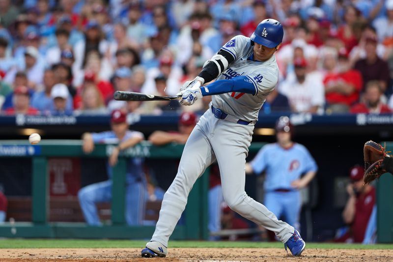 Jul 11, 2024; Philadelphia, Pennsylvania, USA; Los Angeles Dodgers two-way player Shohei Ohtani (17) breaks his bat while hitting into a ground out during the seventh inning against the Philadelphia Phillies at Citizens Bank Park. Mandatory Credit: Bill Streicher-USA TODAY Sports