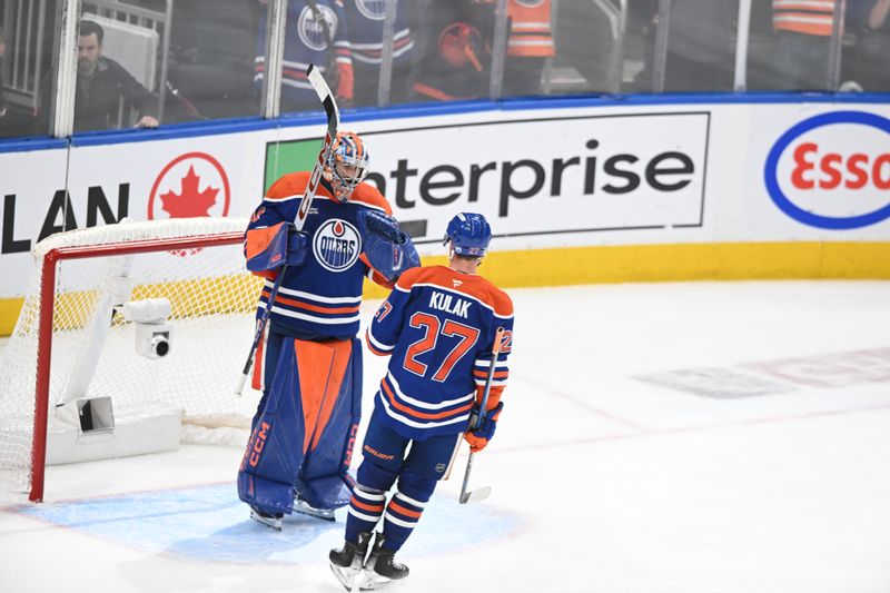 May 12, 2025; Edmonton, Alberta, CAN;  Edmonton Oilers goalie Stuart Skinner (74) celebrates their win with defenseman Brett Kulak (27) over the Las Vegas Golden Knights during the third period in game three of the second round of the 2025 Stanley Cup Playoffs at Rogers Place. Mandatory Credit: Walter Tychnowicz-Imagn Images