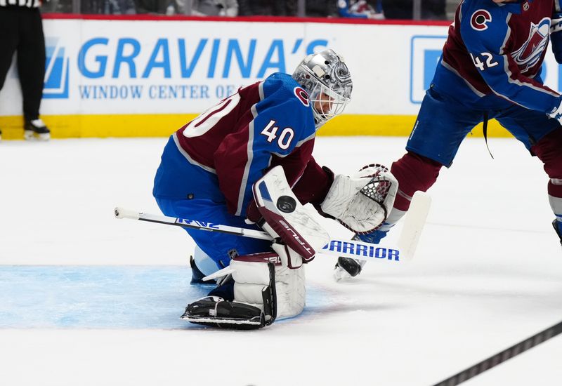 Mar 6, 2024; Denver, Colorado, USA; Colorado Avalanche goaltender Alexandar Georgiev (40) makes a save in the first period against the Detroit Red Wingsat Ball Arena. Mandatory Credit: Ron Chenoy-USA TODAY Sports