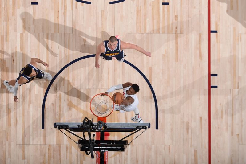 DENVER, CO - MARCH 11: RJ Barrett #9 of the Toronto Raptors dunks the ball during the game against the Denver Nuggets on March 11, 2024 at the Ball Arena in Denver, Colorado. NOTE TO USER: User expressly acknowledges and agrees that, by downloading and/or using this Photograph, user is consenting to the terms and conditions of the Getty Images License Agreement. Mandatory Copyright Notice: Copyright 2024 NBAE (Photo by Bart Young/NBAE via Getty Images)