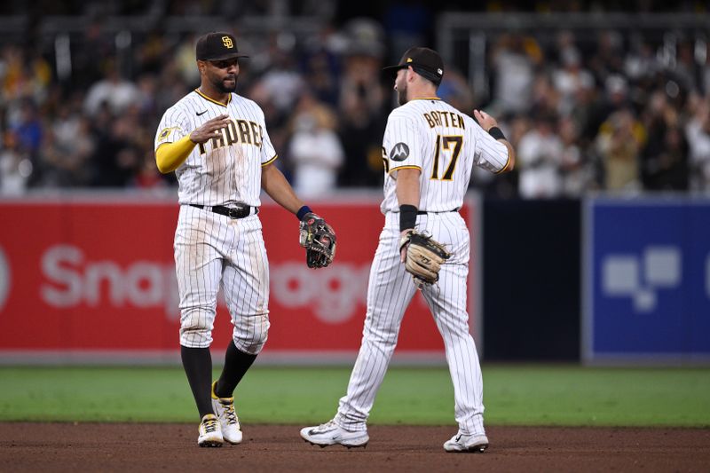 Jul 8, 2023; San Diego, California, USA; San Diego Padres shortstop Xander Bogaerts (left) and second baseman Matthew Batten (17) celebrate on the field after defeating the New York Mets at Petco Park. Mandatory Credit: Orlando Ramirez-USA TODAY Sports