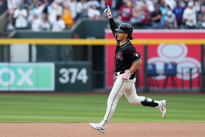May 17, 2025; Phoenix, Arizona, USA; Arizona Diamondbacks outfielder Alek Thomas (5) celebrates solo home run against the Colorado Rockies in the fourth inning at Chase Field. Mandatory Credit: Jacob Reiner-Imagn Images
