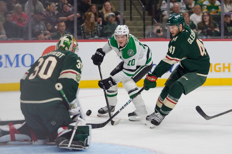 Sep 25, 2025; Saint Paul, Minnesota, USA; Dallas Stars center Oskar Back (10) shoots on Minnesota Wild goaltender Jesper Wallstedt (30) with defenseman Ben Gleason (41) on defense in the first period at Grand Casino Arena. Mandatory Credit: Matt Blewett-Imagn Images
