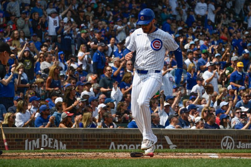 Sep 8, 2024; Chicago, Illinois, USA;  Chicago Cubs outfielder Cody Bellinger (24) crosses home plate after scoring against the New York Yankees during the second inning at Wrigley Field. Mandatory Credit: Matt Marton-Imagn Images