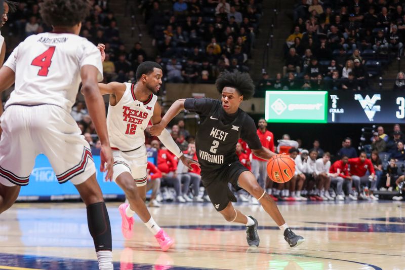 Feb 8, 2026; Morgantown, West Virginia, USA; West Virginia Mountaineers guard Amir Jenkins (2) dribbles against Texas Tech Red Raiders forward Donovan Atwell (12) during the second half at Hope Coliseum. Mandatory Credit: Ben Queen-Imagn Images