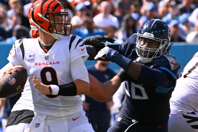 Tennessee Titans defensive end Denico Autry (96) pressures Cincinnati Bengals quarterback Joe Burrow (9) during an NFL football game Sunday, Sept. 30, 2023 in Nashville, Tenn. (AP Photo/John Amis)