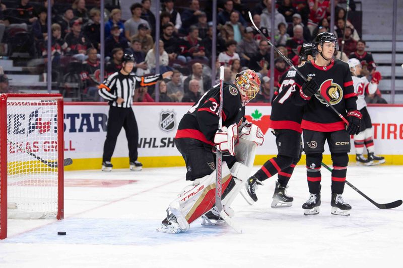 Oct 17, 2024; Ottawa, Ontario, CAN; The Ottawa Senators  including goalie Anton Forsberg (31) and defenseman Jacob Bernardd-Docker (24) react to a goal scored by the  New Jersey Devils  in the second period at the Canadian Tire Centre. Mandatory Credit: Marc DesRosiers-Imagn Images