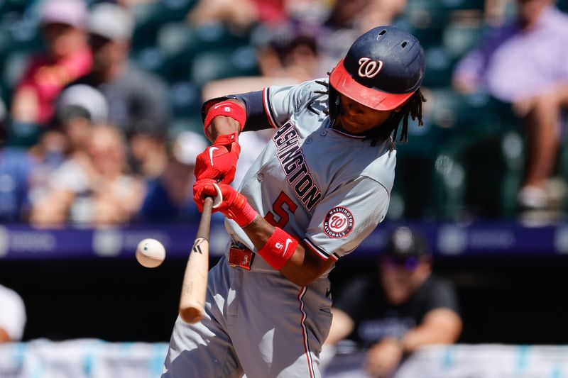 Jun 23, 2024; Denver, Colorado, USA; Washington Nationals shortstop CJ Abrams (5) hits a single in the ninth inning against the Colorado Rockies at Coors Field. Mandatory Credit: Isaiah J. Downing-USA TODAY Sports