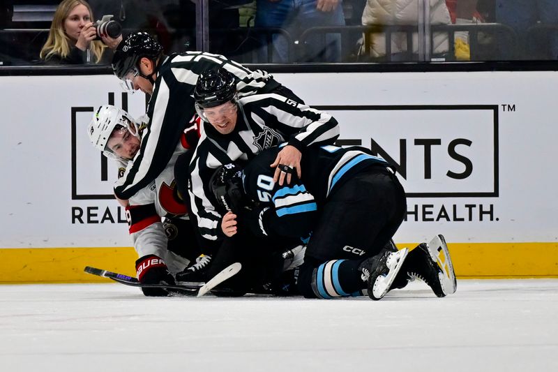 Jan 7, 2026; Salt Lake City, Utah, USA; Referees break up a fight between Ottawa Senators right wing Drake Batherson (19) and Utah Mammoth defenseman Sean Durzi (50) during second period at Delta Center. Mandatory Credit: Peter Creveling-Imagn Images