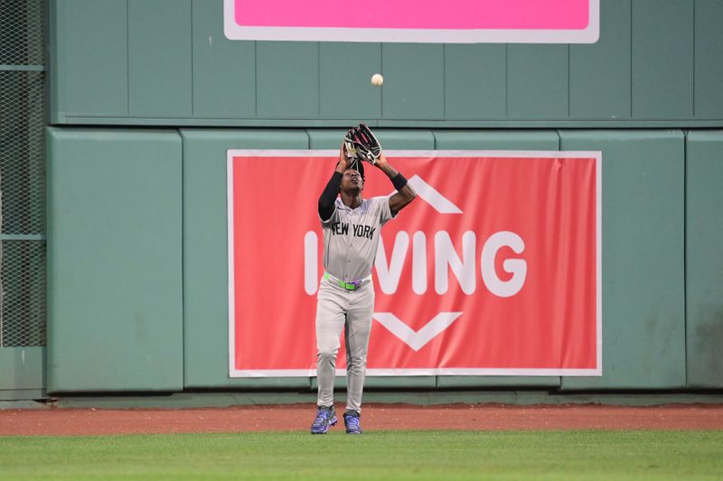 Jul 28, 2024; Boston, Massachusetts, USA;  New York Yankees center fielder Jazz Chisholm Jr (13) makes a catch for an out against the Boston Red Sox during the second inning at Fenway Park. Mandatory Credit: Eric Canha-USA TODAY Sports