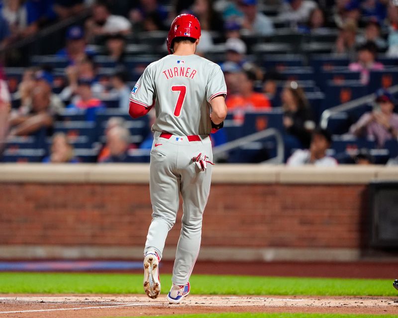 Sep 22, 2024; New York City, New York, USA; Philadelphia Phillies shortstop Trea Turner (7) scores a run on Philadelphia Phillies third baseman Alec Bohm (not pictured) RBI single against the New York Mets during the first inning at Citi Field. Mandatory Credit: Gregory Fisher-Imagn Images