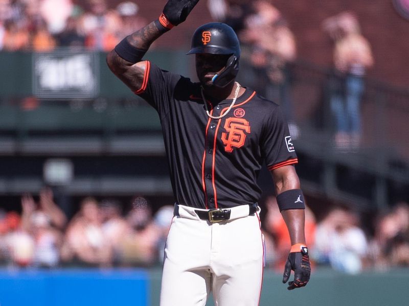 Jun 29, 2024; San Francisco, California, USA; San Francisco Giants designated hitter Jorge Soler (2) motions to his team mates after hitting a double against the Los Angeles Dodgers during the first inning at Oracle Park. Mandatory Credit: Ed Szczepanski-USA TODAY Sports