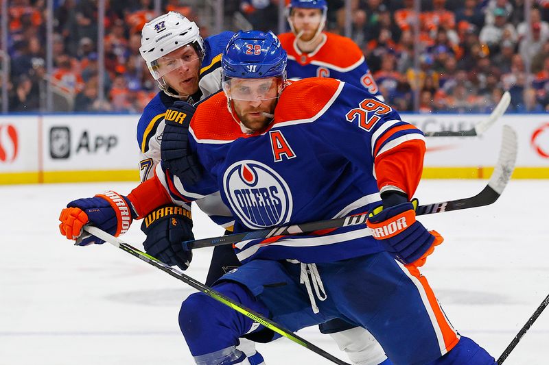 Feb 28, 2024; Edmonton, Alberta, CAN; Edmonton Oilers forward Leon Draisaitl (29) and St. Louis Blues defensemen Torey Krug (47) battles for position during the third period at Rogers Place. Mandatory Credit: Perry Nelson-USA TODAY Sports