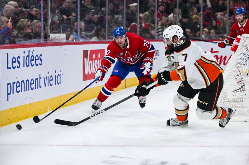 Feb 13, 2024; Montreal, Quebec, CAN; Anaheim Ducks defenseman Radko Gudas (7) defends the puck against Montreal Canadiens left wing Tanner Pearson (70) during the second period at Bell Centre. Mandatory Credit: David Kirouac-USA TODAY Sports