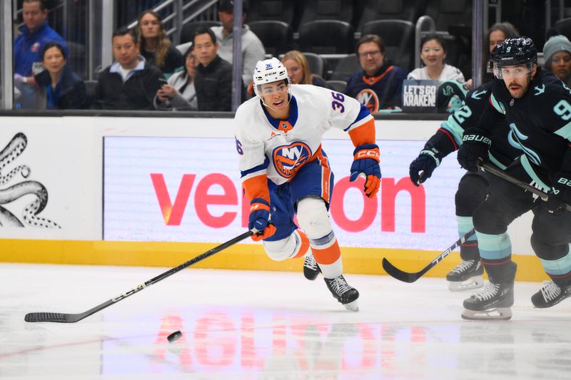 Nov 16, 2024; Seattle, Washington, USA; New York Islanders defenseman Isaiah George (36) passes the puck against the Seattle Kraken during the second period at Climate Pledge Arena. Mandatory Credit: Steven Bisig-Imagn Images