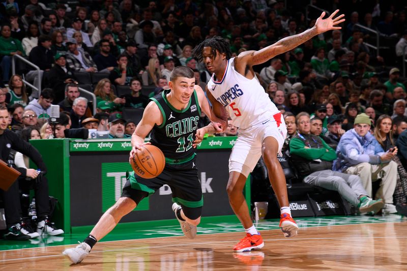 BOSTON, MA - JANUARY 27: Payton Pritchard #11 of the Boston Celtics dribbles the ball during the game against the LA Clippers on January 27, 2024 at the TD Garden in Boston, Massachusetts. NOTE TO USER: User expressly acknowledges and agrees that, by downloading and or using this photograph, User is consenting to the terms and conditions of the Getty Images License Agreement. Mandatory Copyright Notice: Copyright 2024 NBAE  (Photo by Brian Babineau/NBAE via Getty Images)