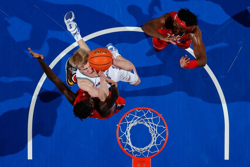 Feb 10, 2023; Colorado Springs, Colorado, USA; Air Force Falcons forward Rytis Petraitis (31) drives to the net against New Mexico Lobos forward Morris Udeze (24) as forward Birima Seck (34) defends in the second half at Clune Arena. Mandatory Credit: Isaiah J. Downing-USA TODAY Sports