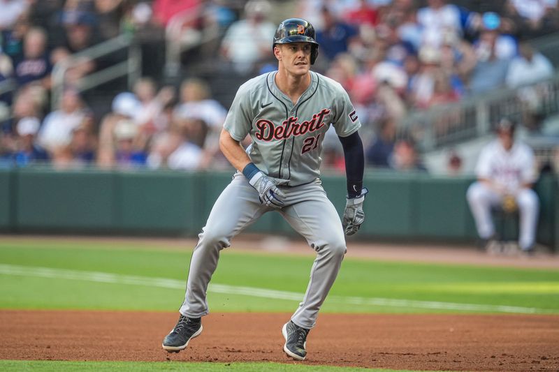 Jun 17, 2024; Cumberland, Georgia, USA; Detroit Tigers designated hitter Mark Canha (21) leads off of first base against the Atlanta Braves during the first inning at Truist Park. Mandatory Credit: Dale Zanine-USA TODAY Sports