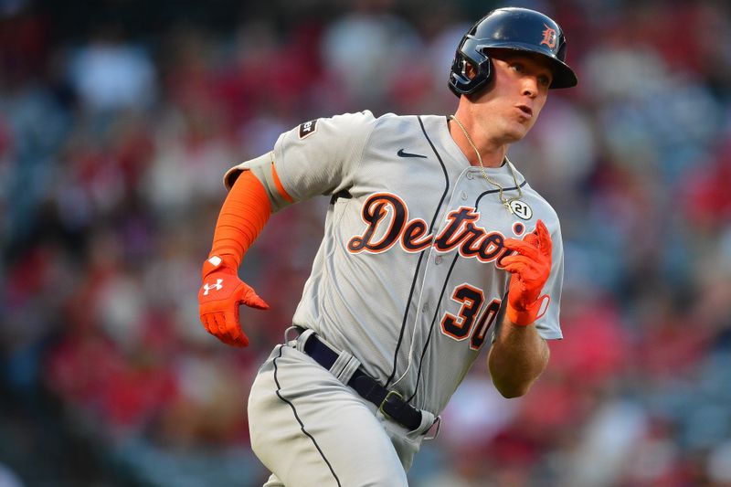 Sep 15, 2023; Anaheim, California, USA; Detroit Tigers right fielder Kerry Carpenter (30) runs after hitting a single against the Los Angeles Angels during the first inning at Angel Stadium. Mandatory Credit: Gary A. Vasquez-USA TODAY Sports