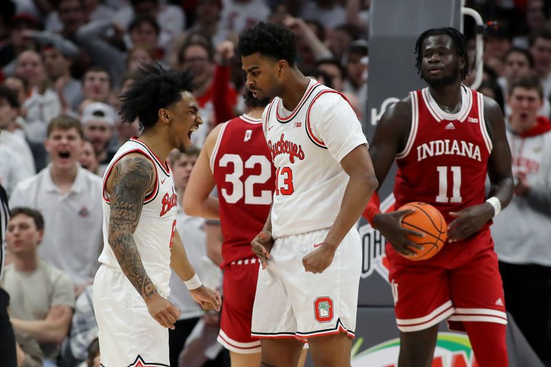 Jan 17, 2025; Columbus, Ohio, USA; Ohio State Buckeyes forward Sean Stewart (13) celebrates a basket with guard Ques Glover (6) during the first half against the Indiana Hoosiers at Value City Arena. Mandatory Credit: Joseph Maiorana-Imagn Images