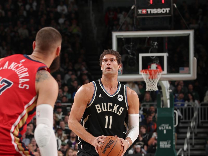 MILWAUKEE, WI - JANUARY 27:  Brook Lopez #11 of the Milwaukee Bucks handles the ball during the game  on January 27, 2024 at the Fiserv Forum Center in Milwaukee, Wisconsin. NOTE TO USER: User expressly acknowledges and agrees that, by downloading and or using this Photograph, user is consenting to the terms and conditions of the Getty Images License Agreement. Mandatory Copyright Notice: Copyright 2024 NBAE (Photo by Gary Dineen/NBAE via Getty Images).