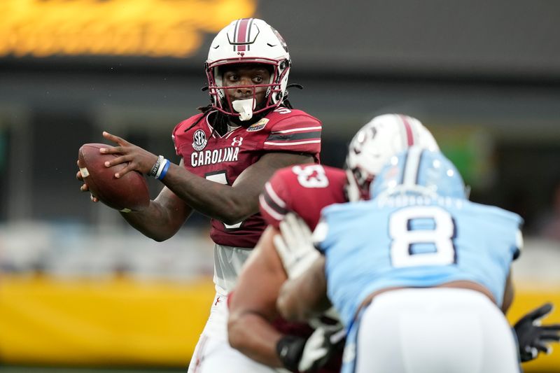 Dec 30, 2021; Charlotte, NC, USA; South Carolina Gamecocks wide receiver Dakereon Joyner (5) takes the snap against the North Carolina Tar Heels during the first quarter at Bank of America Stadium. Mandatory Credit: Jim Dedmon-USA TODAY Sports