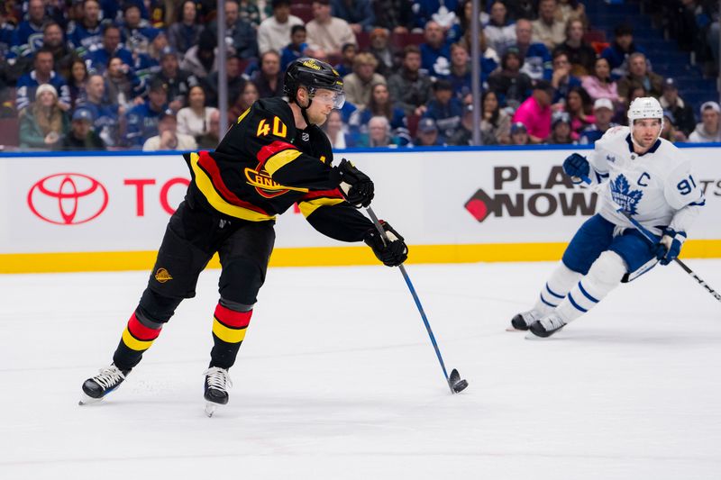 Jan 20, 2024; Vancouver, British Columbia, CAN;  Vancouver Canucks forward Elias Pettersson (40) makes a pass against the Toronto Maple Leafs in the second period at Rogers Arena. Mandatory Credit: Bob Frid-USA TODAY Sports