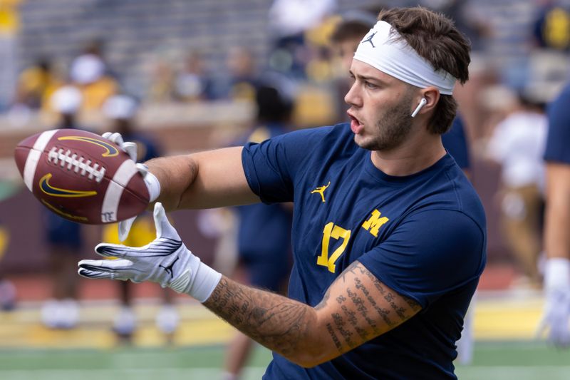 Sep 9, 2023; Ann Arbor, Michigan, USA; Michigan Wolverines tight end Marlin Klein (17) catches the ball in warm ups before the game against the UNLV Rebels at Michigan Stadium. Mandatory Credit: David Reginek-USA TODAY Sports