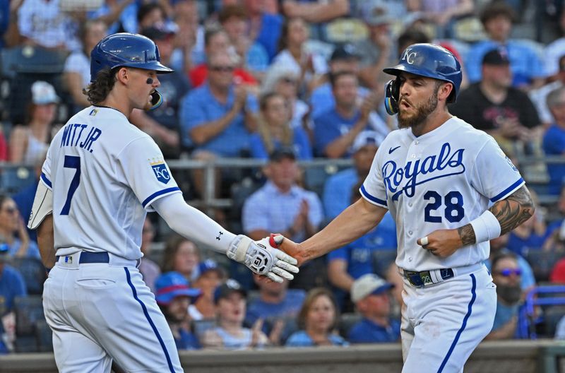 Jul 29, 2023; Kansas City, Missouri, USA;  Kansas City Royals center fielder Kyle Isbel (28) celebrates with Bobby Witt Jr. (7) after scoring a run during the second inning against the Minnesota Twins at Kauffman Stadium. Mandatory Credit: Peter Aiken-USA TODAY Sports