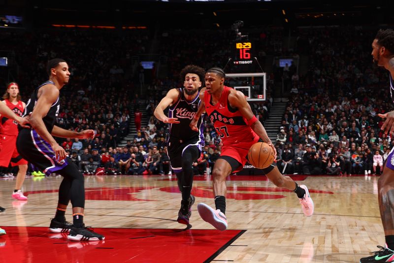 TORONTO, CANADA - MARCH 20: Jahmi'us Ramsey #37 of the Toronto Raptors drives to the basket during the game against the Sacramento Kings on March 20, 2024 at the Scotiabank Arena in Toronto, Ontario, Canada.  NOTE TO USER: User expressly acknowledges and agrees that, by downloading and or using this Photograph, user is consenting to the terms and conditions of the Getty Images License Agreement.  Mandatory Copyright Notice: Copyright 2024 NBAE (Photo by Vaughn Ridley/NBAE via Getty Images)