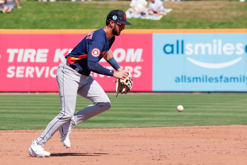 Feb 28, 2023; Port St. Lucie, Florida, USA; Houston Astros short stop David Hensley (17) uses his body to block the ball during the second inning against the New York Mets at Clover Park. Mandatory Credit: Reinhold Matay-USA TODAY Sports