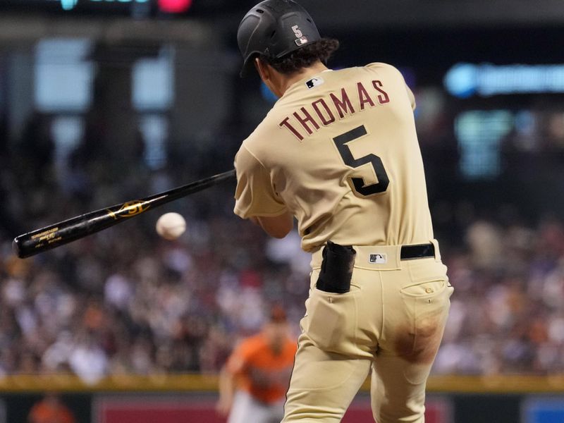 Sep 2, 2023; Phoenix, Arizona, USA; Arizona Diamondbacks center fielder Alek Thomas (5) hits a fielder   s choice RBI ground out against the Baltimore Orioles during the third inning at Chase Field. Mandatory Credit: Joe Camporeale-USA TODAY Sports