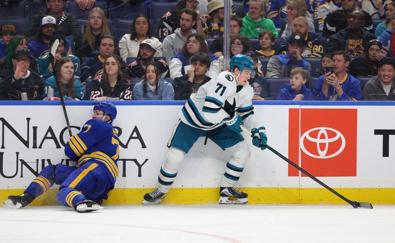 Mar 10, 2026; Buffalo, New York, USA;  Buffalo Sabres center Ryan McLeod (71) tries to check San Jose Sharks center Macklin Celebrini (71) as he controls the puck during the third period at KeyBank Center. Mandatory Credit: Timothy T. Ludwig-Imagn Images
