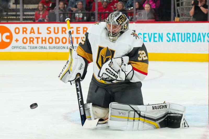 Mar 11, 2023; Raleigh, North Carolina, USA;  Vegas Golden Knights goaltender Jonathan Quick (32) makes a save against the Carolina Hurricanes during the first period at PNC Arena. Mandatory Credit: James Guillory-USA TODAY Sports