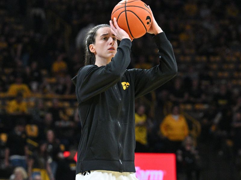 Mar 3, 2024; Iowa City, Iowa, USA; Iowa Hawkeyes guard Caitlin Clark (22) warms up before the game against the Ohio State Buckeyes at Carver-Hawkeye Arena. Clark is attempting to break the NCAA basketball all-time scoring record. Mandatory Credit: Jeffrey Becker-USA TODAY Sports