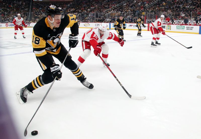 Nov 13, 2024; Pittsburgh, Pennsylvania, USA;  Pittsburgh Penguins right wing Jesse Puljujarvi (18) shoots against the Detroit Red Wings during the first period at PPG Paints Arena. Mandatory Credit: Charles LeClaire-Imagn Images