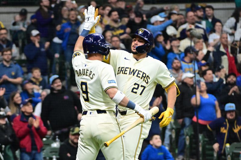 Apr 7, 2024; Milwaukee, Wisconsin, USA;  Milwaukee Brewers shortstop Willy Adames (27) celebrates with first baseman Jake Bauers (9) after hitting a solo home run in the fourth inning against the Seattle Mariners at American Family Field. Mandatory Credit: Benny Sieu-USA TODAY Sports