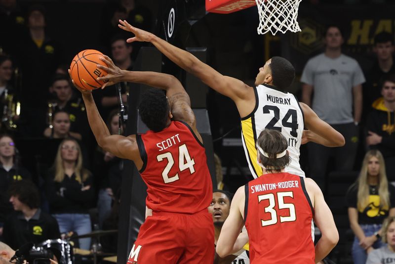 Jan 15, 2023; Iowa City, Iowa, USA; Iowa Hawkeyes forward Kris Murray (24) defends Maryland Terrapins forward Donta Scott (24) at Carver-Hawkeye Arena.  The Hawkeyes beat the Terrapins 81 to 67. Mandatory Credit: Reese Strickland-USA TODAY Sports