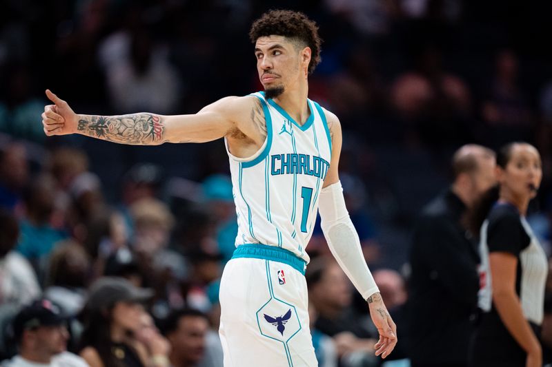 CHARLOTTE, NORTH CAROLINA - OCTOBER 06: LaMelo Ball #1 of the Charlotte Hornets looks on in the first quarter during a preseason game against the New York Knicks at Spectrum Center on October 06, 2024 in Charlotte, North Carolina. NOTE TO USER: User expressly acknowledges and agrees that, by downloading and or using this photograph, User is consenting to the terms and conditions of the Getty Images License Agreement. (Photo by Jacob Kupferman/Getty Images)